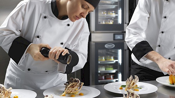 Unox Oven with chefs preparing meals
